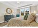 Main bedroom with large windows, neutral decor, and a cozy sitting area at 137 Winding Grove Ln, Moncks Corner, SC 29461