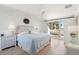 Spacious bedroom with light-blue bedding, hardwood floors, and access to a private balcony at 1505 Marsh Haven, Johns Island, SC 29455