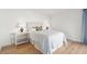 Guest bedroom with full-size bed, light walls, and hardwood floors at 1505 Marsh Haven, Johns Island, SC 29455