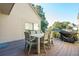 Deck features a dining table, chairs, and grill, perfect for outdoor dining at 1505 Marsh Haven, Johns Island, SC 29455