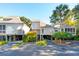 Two-story townhome with light-colored siding, ample parking and landscaping at 1505 Marsh Haven, Johns Island, SC 29455