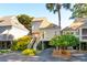 Elevated home with a light beige exterior and lush landscaping at 1505 Marsh Haven, Johns Island, SC 29455