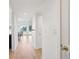 Bright hallway with light wood floors leading to a view of the living area and water at 1505 Marsh Haven, Johns Island, SC 29455