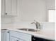 Modern kitchen sink with chrome faucet, and white quartz countertops at 1505 Marsh Haven, Johns Island, SC 29455