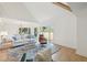 Bright living room with vaulted ceiling, hardwood floors, and serene marsh views at 1505 Marsh Haven, Johns Island, SC 29455