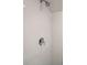 White tiled shower with a rainfall shower head at 1505 Marsh Haven, Johns Island, SC 29455