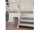 White staircase with wooden treads and a built-in storage area underneath at 1505 Marsh Haven, Johns Island, SC 29455