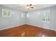 Spacious bedroom with hardwood floors and light blue walls at 1530 Oak Island Dr, Charleston, SC 29412