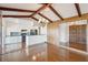 Open dining room with hardwood floors and exposed wooden beams at 1530 Oak Island Dr, Charleston, SC 29412