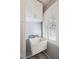 Laundry room with utility sink and overhead storage at 1530 Oak Island Dr, Charleston, SC 29412