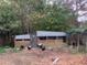 Modern chicken coop with chickens in the yard at 1661 Lonnie Taylor Ln, Wadmalaw Island, SC 29487