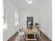 Home office with wood desk and white chairs at 1904 Village Crossing Dr, Charleston, SC 29492