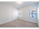 Bright bedroom with neutral walls, carpet, and two windows at 2257 Blue Bayou Blvd, Johns Island, SC 29455