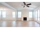 Spacious living area with hardwood floors, fireplace and large windows at 2257 Blue Bayou Blvd, Johns Island, SC 29455