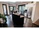 Eat-in kitchen with granite counters, dark cabinets, stainless steel appliances & access to patio at 2860 Old Drake Dr, Johns Island, SC 29455