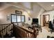 Open loft with comfortable seating, TV, and access to other rooms at 2860 Old Drake Dr, Johns Island, SC 29455