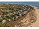 Aerial view showing a house's location near the beach and other homes at 3131 Palmetto Blvd, Edisto Island, SC 29438
