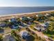 Aerial view showcasing a beach house near the water with a boat in view at 3131 Palmetto Blvd, Edisto Island, SC 29438