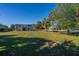 Spacious backyard with mature trees and landscaping at 3131 Palmetto Blvd, Edisto Island, SC 29438