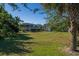 Large backyard with mature trees and landscaping at 3131 Palmetto Blvd, Edisto Island, SC 29438