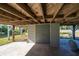 Under house storage area with concrete floor and large storage door at 3131 Palmetto Blvd, Edisto Island, SC 29438
