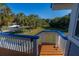 Deck with ocean view and palm trees at 3131 Palmetto Blvd, Edisto Island, SC 29438
