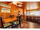 Bright dining area with wood-paneled walls and a charming wooden table at 3131 Palmetto Blvd, Edisto Island, SC 29438