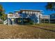 Elevated home with wrap around deck and spacious yard at 3131 Palmetto Blvd, Edisto Island, SC 29438