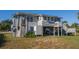 Beach house exterior with gray siding, deck, and outdoor shower at 3131 Palmetto Blvd, Edisto Island, SC 29438