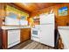 Bright kitchen with white appliances and wood cabinets at 3131 Palmetto Blvd, Edisto Island, SC 29438