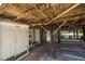 Covered patio with picnic table and seating area under house at 3131 Palmetto Blvd, Edisto Island, SC 29438