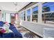 Bright sunroom with comfy seating and ample natural light at 3131 Palmetto Blvd, Edisto Island, SC 29438