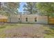 Large backyard with a wooden fence and mature trees at 3264 Stonehaven Dr, North Charleston, SC 29420