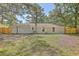Large backyard with a wooden fence and mature trees at 3264 Stonehaven Dr, North Charleston, SC 29420