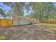 Large backyard with a wooden fence and mature trees at 3264 Stonehaven Dr, North Charleston, SC 29420
