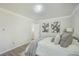 Serene bedroom with gray flooring, a white bed, and tasteful decor at 3264 Stonehaven Dr, North Charleston, SC 29420