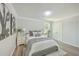 Bright bedroom with gray flooring and a window, featuring tasteful decor at 3264 Stonehaven Dr, North Charleston, SC 29420