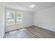 Bright bedroom with gray flooring and large windows at 3264 Stonehaven Dr, North Charleston, SC 29420