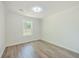 Well-lit bedroom featuring gray flooring and a window at 3264 Stonehaven Dr, North Charleston, SC 29420