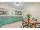 Modern kitchen with green cabinets, granite countertops, and a kitchen island at 3264 Stonehaven Dr, North Charleston, SC 29420