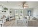 Bright living room features a comfy sofa, stylish armchair, and a ceiling fan at 3264 Stonehaven Dr, North Charleston, SC 29420