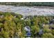 Aerial view showing home, pool, and private dock access at 371 Live Palmetto Bluff, Mount Pleasant, SC 29464