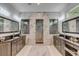 Large bathroom with double vanities, marble tile, and a walk-in shower at 371 Live Palmetto Bluff, Mount Pleasant, SC 29464