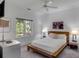 Bright bedroom with a comfortable bed, large window, and ceiling fan at 371 Live Palmetto Bluff, Mount Pleasant, SC 29464