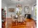 Formal dining room with hardwood floors and round table for six at 371 Live Palmetto Bluff, Mount Pleasant, SC 29464