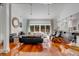 Spacious living room with hardwood floors, fireplace, and access to the pool at 371 Live Palmetto Bluff, Mount Pleasant, SC 29464