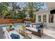 Inviting pool area with patio furniture, and wooden privacy wall at 371 Live Palmetto Bluff, Mount Pleasant, SC 29464