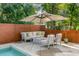 Outdoor patio with pool, seating area, and umbrella at 371 Live Palmetto Bluff, Mount Pleasant, SC 29464
