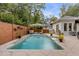 Resort-style pool with patio furniture and wooden privacy wall at 371 Live Palmetto Bluff, Mount Pleasant, SC 29464