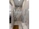 Large walk-in shower with marble tile and built-in seat at 371 Live Palmetto Bluff, Mount Pleasant, SC 29464